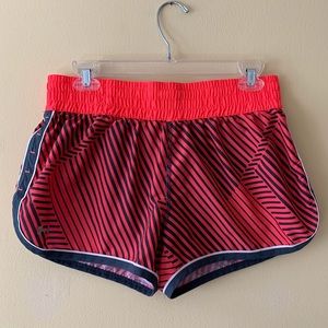 Medium Under Armour shorts. Coral and grey.